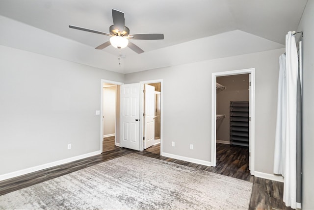 1739 Barons Cv, Hebron, KY 41048 - unfurnished bedroom featuring dark wood-style floors, a spacious closet, baseboards, a closet, and connected bathroom
