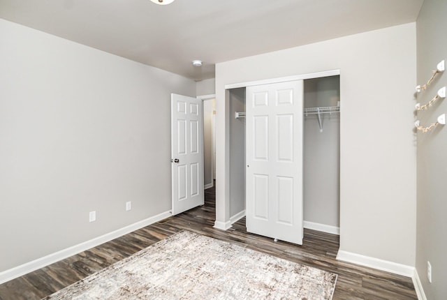 1739 Barons Cv, Hebron, KY 41048 - unfurnished bedroom featuring dark wood-type flooring, baseboards, and a closet