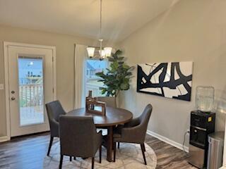1739 Barons Cv, Hebron, KY 41048 - dining room with a chandelier, wood finished floors, baseboards, and vaulted ceiling