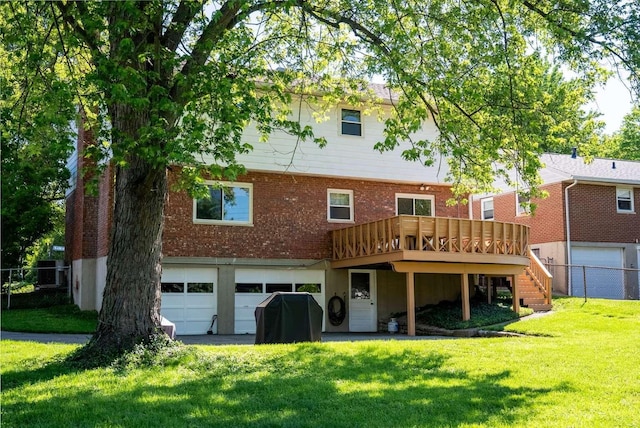 3416 Meadowlark Dr, Edgewood, KY 41018 - back of property with an attached garage, a deck, stairs, asphalt driveway, and brick siding