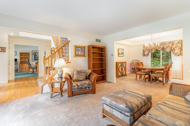 816 Winterberry Ct, Villa Hills, KY 41017 - living room featuring stairway, a chandelier, light carpet, baseboards, and crown molding