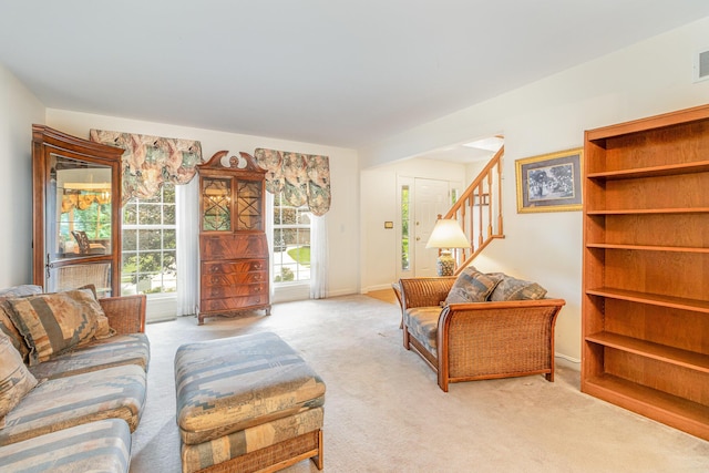 816 Winterberry Ct, Villa Hills, KY 41017 - living area featuring light carpet, stairs, and baseboards