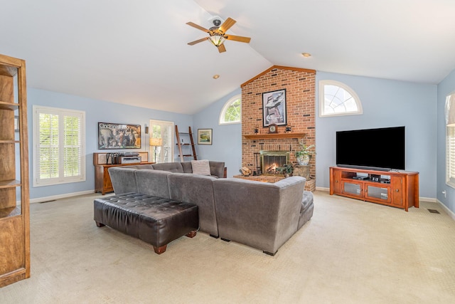 816 Winterberry Ct, Villa Hills, KY 41017 - carpeted living area with vaulted ceiling, ceiling fan, a fireplace, baseboards, and plenty of natural light