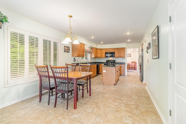816 Winterberry Ct, Villa Hills, KY 41017 - dining space featuring baseboards, light stone finish floors, and recessed lighting
