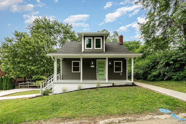 404 Locust St, Erlanger, KY 41018 - view of front of house featuring a chimney, covered porch, a front yard, and roof with shingles