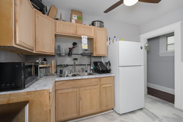 622 W 12th St, Covington, KY 41011 - kitchen with black microwave, freestanding refrigerator, a sink, light countertops, and a ceiling fan