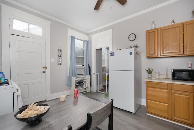 622 W 12th St, Covington, KY 41011 - kitchen featuring freestanding refrigerator, wood finished floors, ornamental molding, a ceiling fan, and black microwave