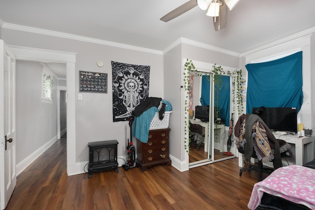 622 W 12th St, Covington, KY 41011 - home office featuring wood finished floors, crown molding, a ceiling fan, a wood stove, and baseboards