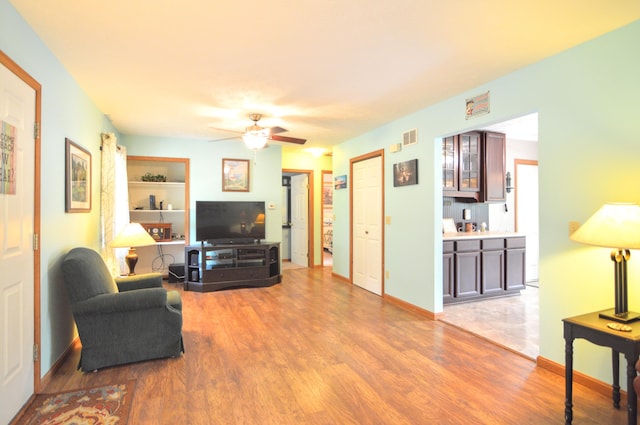 445 Elk Lk Lot 945/946, Owenton, KY 40359 - living area with wood finished floors, ceiling fan, and baseboards