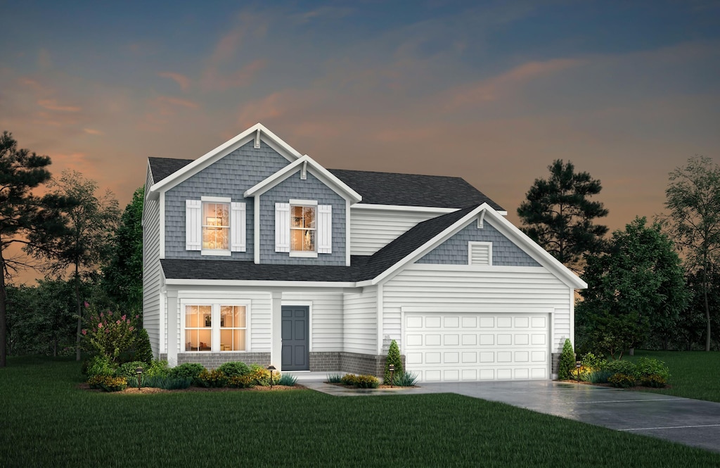 10468 Fairbourne Dr, Covington, KY 41015 - view of front facade with driveway, a front yard, and a garage