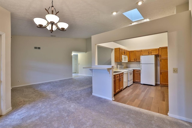 328 Deepwoods Dr, Highland Heights, KY 41076 - kitchen featuring white appliances, a skylight, light countertops, and light colored carpet