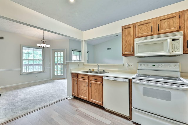 328 Deepwoods Dr, Highland Heights, KY 41076 - kitchen featuring white appliances, a sink, light wood-style flooring, a chandelier, and light countertops