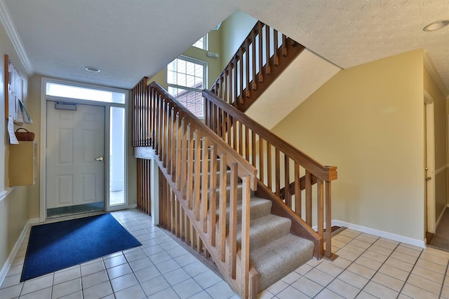 328 Deepwoods Dr, Highland Heights, KY 41076 - foyer entrance featuring baseboards, light tile patterned flooring, stairway, a textured ceiling, and recessed lighting