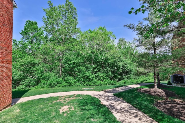 328 Deepwoods Dr, Highland Heights, KY 41076 - view of grassy yard featuring central AC