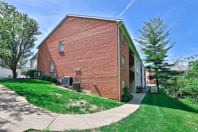 328 Deepwoods Dr, Highland Heights, KY 41076 - view of home's exterior featuring a yard, central air condition unit, and brick siding