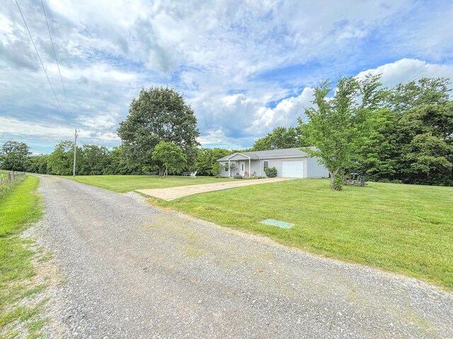 15295 Parkers Grove Rd, Morning View, KY 41063 - view of front of house featuring driveway, an attached garage, and a front yard