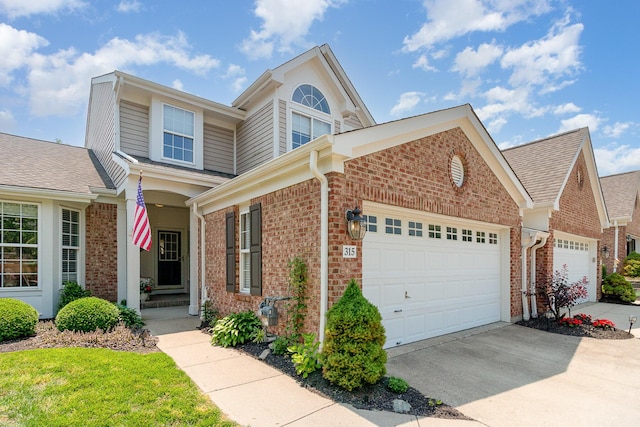 315 Shadow Ridge Dr, Highland Heights, KY 41076 - traditional-style house featuring brick siding, a garage, concrete driveway, and roof with shingles