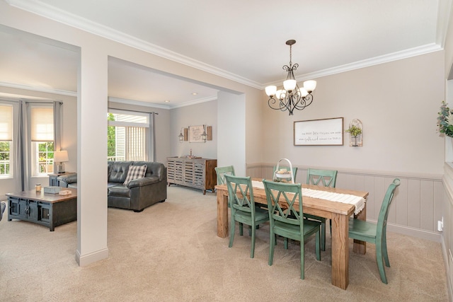 315 Shadow Ridge Dr, Highland Heights, KY 41076 - dining area with light carpet, crown molding, a chandelier, and a wainscoted wall