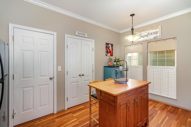 315 Shadow Ridge Dr, Highland Heights, KY 41076 - kitchen with crown molding, wood counters, light wood-style flooring, pendant lighting, and brown cabinetry