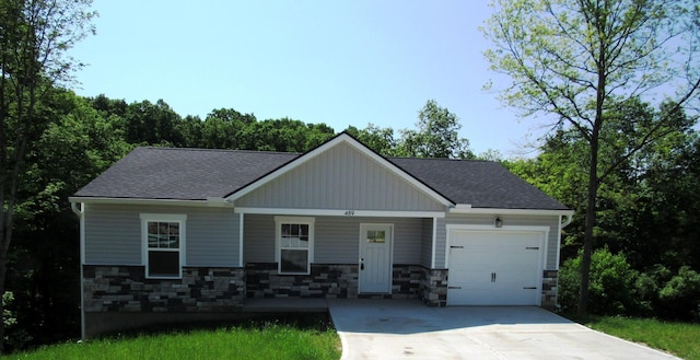 489 Eagle Creek Dr, Dry Ridge, KY 41035 - craftsman-style home with an attached garage, concrete driveway, stone siding, covered porch, and roof with shingles