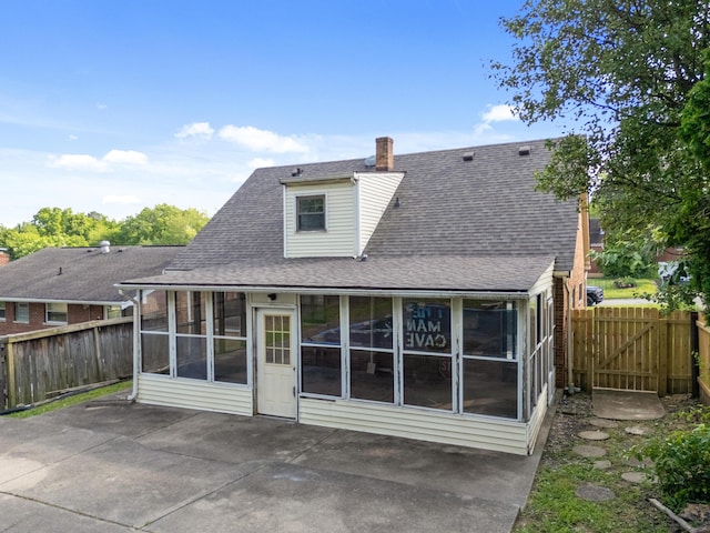 420 Locust St, Erlanger, KY 41018 - rear view of property featuring a sunroom, a patio area, and a fenced backyard