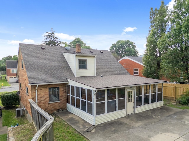 420 Locust St, Erlanger, KY 41018 - back of house with a sunroom, cooling unit, a patio area, and a shingled roof