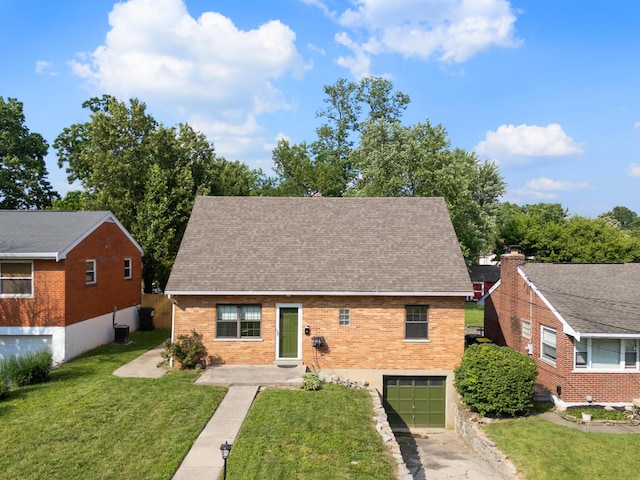 420 Locust St, Erlanger, KY 41018 - view of front facade with brick siding, a garage, a shingled roof, and a front lawn