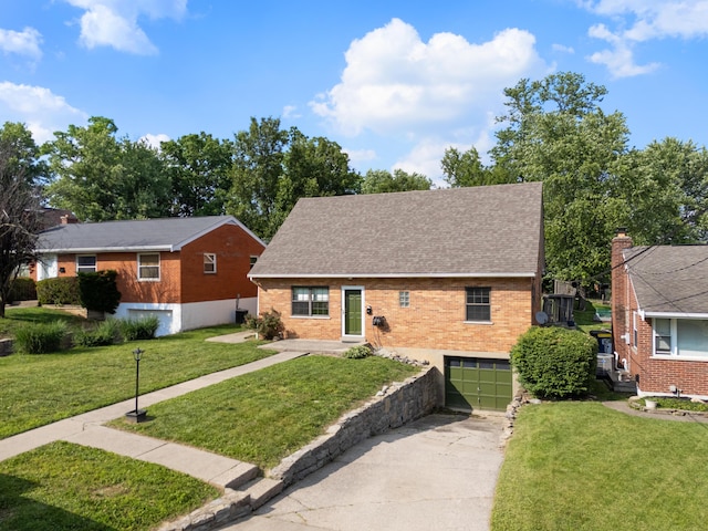 420 Locust St, Erlanger, KY 41018 - view of front of home with driveway, an attached garage, a front yard, a shingled roof, and brick siding