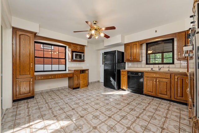 420 Locust St, Erlanger, KY 41018 - kitchen with black appliances, light floors, light countertops, brown cabinets, and ceiling fan