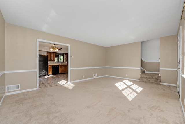 420 Locust St, Erlanger, KY 41018 - unfurnished living room featuring light colored carpet, baseboards, stairs, and ceiling fan