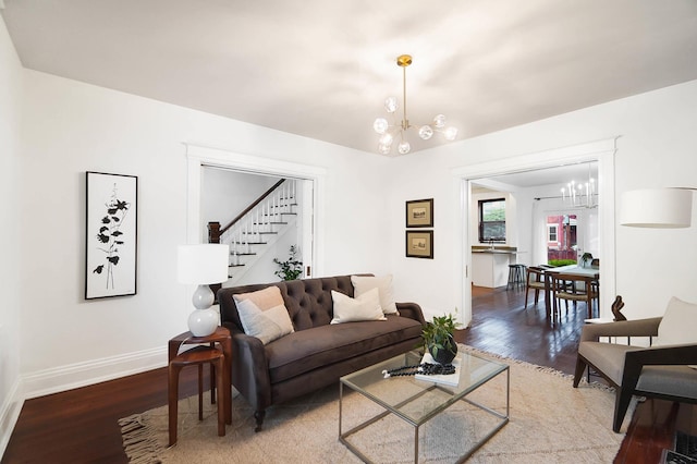 645 Maple Ave, Newport, KY 41071 - living room featuring a chandelier, wood finished floors, and stairway