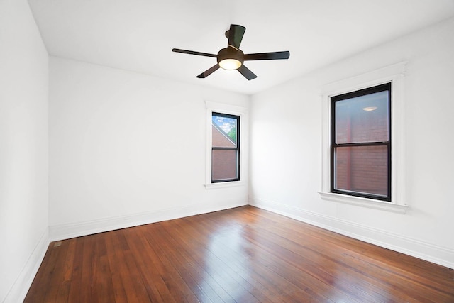 645 Maple Ave, Newport, KY 41071 - unfurnished room featuring hardwood / wood-style floors, baseboards, and a ceiling fan