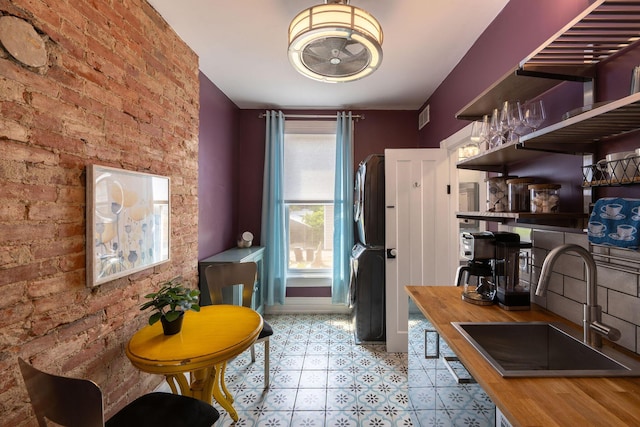 411 Elm St, Ludlow, KY 41016 - dining space with brick wall and tile patterned floors
