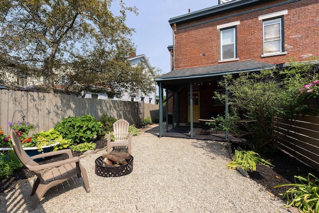 411 Elm St, Ludlow, KY 41016 - back of house with brick siding, a fire pit, and a patio