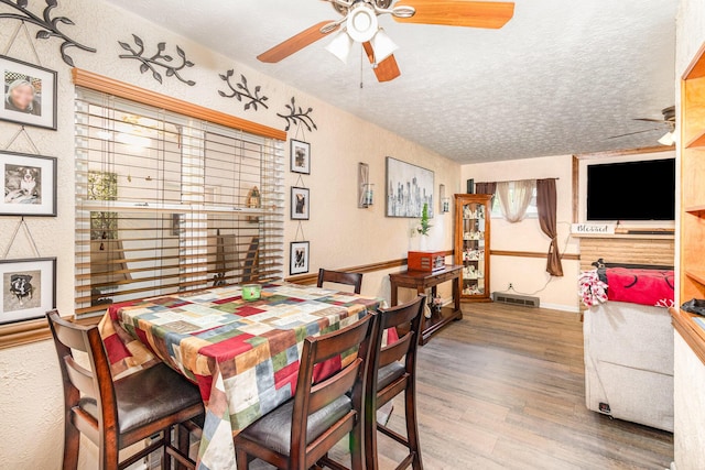 304 Humes Ridge Rd, Williamstown, KY 41097 - dining space with a textured ceiling, ceiling fan, wood finished floors, and baseboards