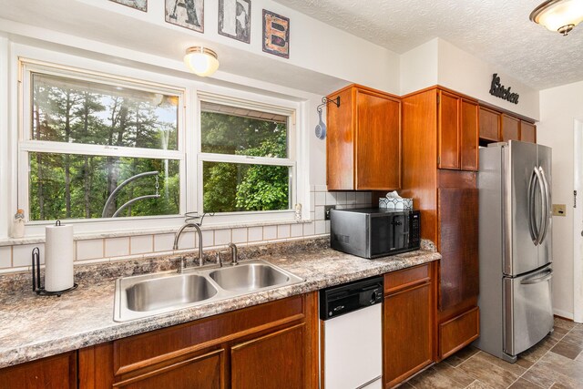 304 Humes Ridge Rd, Williamstown, KY 41097 - kitchen with freestanding refrigerator, black microwave, dishwasher, a sink, and brown cabinetry