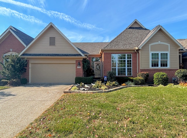 1940 Marktwain Way, Villa Hills, KY 41017 - view of front of house featuring brick siding, a garage, a front yard, and driveway