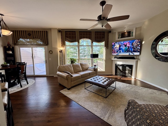 1940 Marktwain Way, Villa Hills, KY 41017 - living room featuring a glass covered fireplace, a ceiling fan, wood finished floors, and plenty of natural light