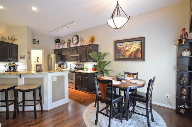 1940 Marktwain Way, Villa Hills, KY 41017 - dining room with dark wood-style floors, recessed lighting, and rail lighting