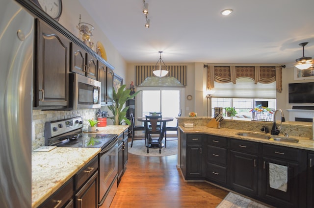 1940 Marktwain Way, Villa Hills, KY 41017 - kitchen featuring stainless steel appliances, a sink, dark wood-style flooring, light stone counters, and a ceiling fan