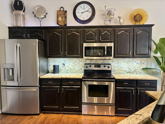 1940 Marktwain Way, Villa Hills, KY 41017 - kitchen with appliances with stainless steel finishes, light stone counters, backsplash, and light wood finished floors