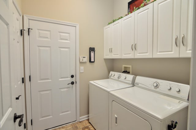 1940 Marktwain Way, Villa Hills, KY 41017 - washroom with separate washer and dryer, cabinet space, baseboards, and light stone finish flooring