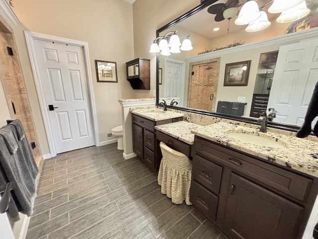 1940 Marktwain Way, Villa Hills, KY 41017 - bathroom with a stall shower, vanity, toilet, baseboards, and a chandelier