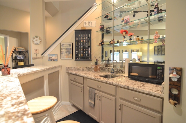 1940 Marktwain Way, Villa Hills, KY 41017 - indoor wet bar featuring black microwave and light tile patterned flooring