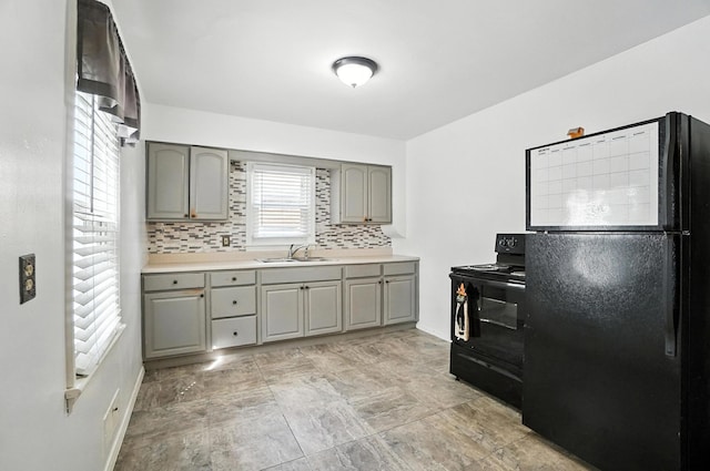 3314 Elizabeth St, Erlanger, KY 41018 - kitchen featuring black appliances, gray cabinetry, backsplash, and light countertops