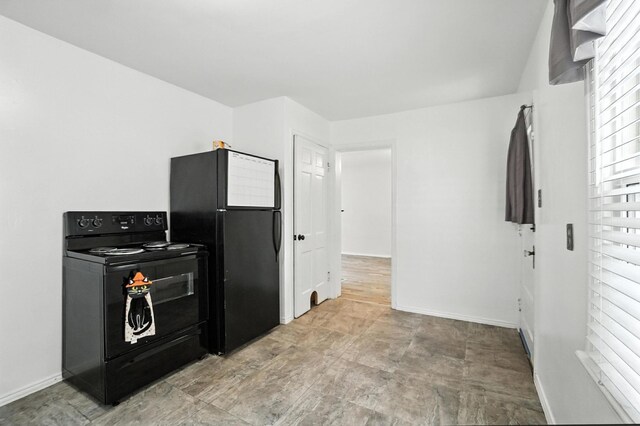 3314 Elizabeth St, Erlanger, KY 41018 - kitchen featuring black appliances and baseboards