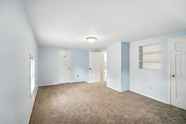 3314 Elizabeth St, Erlanger, KY 41018 - carpeted empty room featuring built in shelves and baseboards