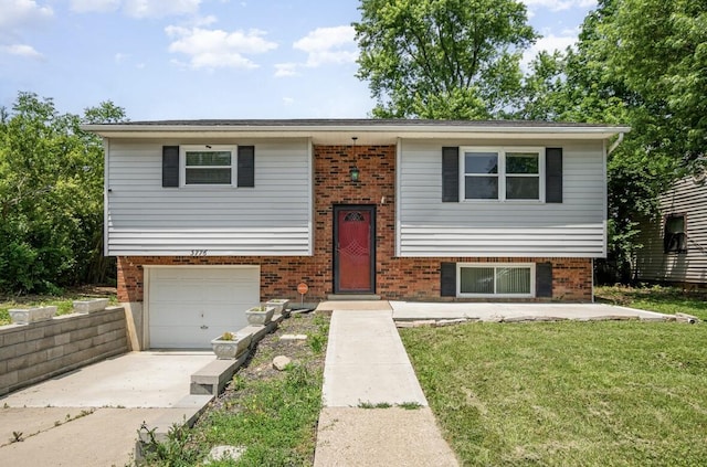 3776 Feather Ln, Elsmere, KY 41018 - raised ranch with concrete driveway, brick siding, a garage, and a front yard
