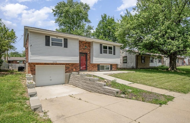 3776 Feather Ln, Elsmere, KY 41018 - view of front facade featuring driveway, brick siding, a front yard, an attached garage, and cooling unit