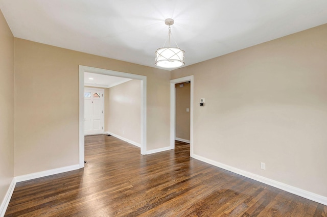 1191 Wilson Rd, Bellevue, KY 41073 - unfurnished room featuring baseboards and dark wood-style flooring